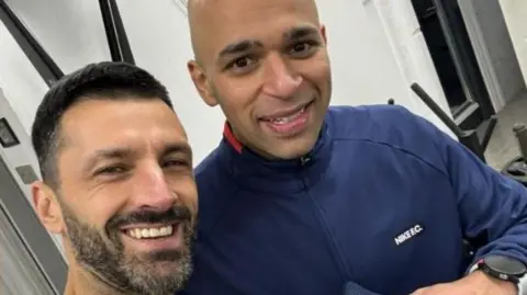 A selfie of Helder Barroso and Amit Sammani who are both smiling.
