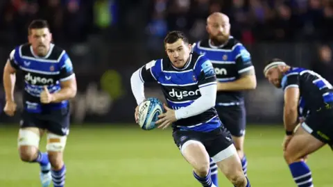 Ben Spencer runs with the ball during a match