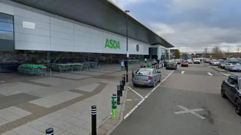 A street view image of an Asda supermarket as seen from the car park.