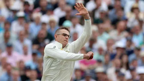 Todd Murphy bowling for Australia in the fifth Test against England in 2023