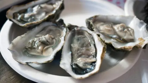 Getty Images A plate of oysters opened and ready for consumption