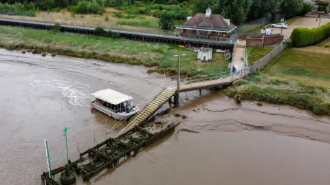 KLWNBC Aerial view of King's Lynn Ferry pulling alongside the jetty on the West Lynn side