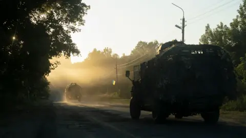 EPA Ukrainian forces travel towards the Kursk region on a supply route in Sumy last August. By March of this year, their retreat was in full swing.