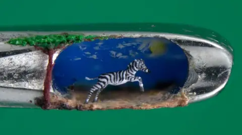 David A Lindon A running zebra in the eye of a needle