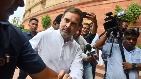Getty Images Indian National Congress party leader Rahul Gandhi (C) arrives at the Parliament in New Delhi on June 26, 2024. India's new leader of the opposition Rahul Gandhi said on June 26 that his lawmakers would not be silenced, in his first speech since formally taking up a post vacant for a decade. (Photo by AFP) (Photo by -/AFP via Getty Images)