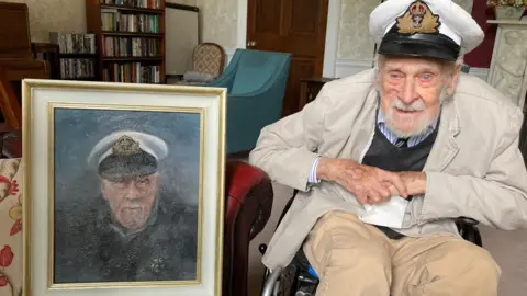 BBC Richard Willis sat with his self portrait