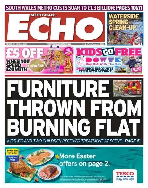 South Wales Echo South Wales Echo mai headline: Furniture thrown from burning flat; Mother and two children received treatment at scene. Image of a fire engine in the top right corner.