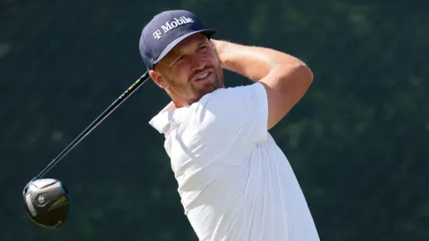 Wyndham Clark hitting a golf shot