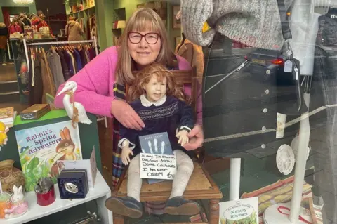 Doll in shop window