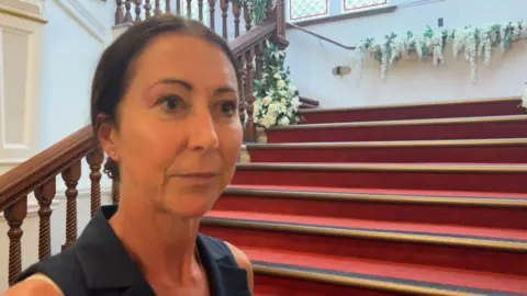 Andrew Turner/BBC Sheila Oxtoby on the steps of Great Yarmouth Town Hall