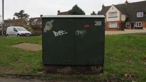 Wychavon District Council A green cabinet with some graffiti.