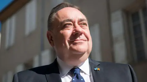 Getty Images Alex Salmond standing in street