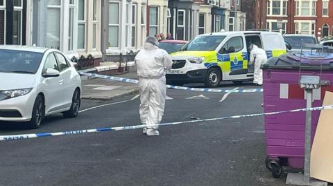 Forensic officers in Bigham Road, Fairfield