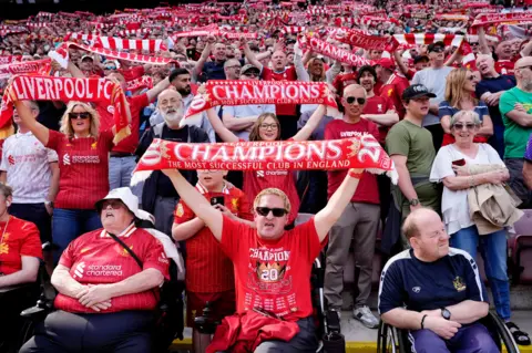 PA Media Liverpool fans celebrate winning the Premier League