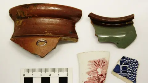 Leicestershire County Council and Archaeological Research Services A number of pieces of pottery discovered at the site of the North and East Melton Mowbray Distributor Road