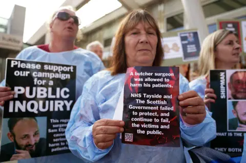 PA Media Protesters outside the Scottish Parliament in Edinburgh are asking for a public inquiry into the care given to patients by "disgraced surgeon" Professor Sam Eljamel who worked at NHS Tayside between 1995 and 2013.