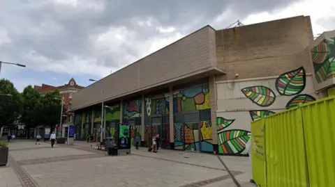 Google A street view boarded up former shops in Nottingham's Lister Gate