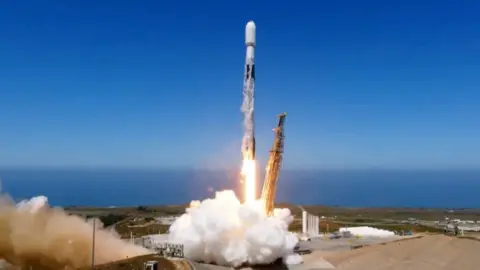 Falcon 9 rocket astatine  infinitesimal   of liftoff