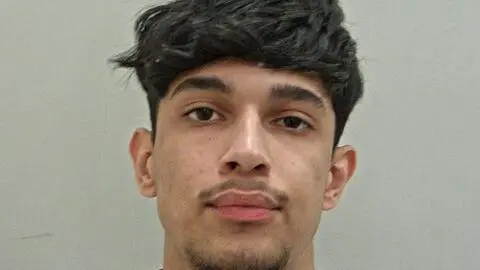 Lancashire Police A mugshot of Ashir Shahid, who has thick black hair, cut short on the sides and a goatee.