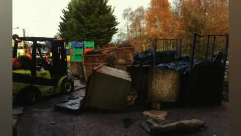 Picture of fallen skips at the Pirelli tyre factory in Carlisle