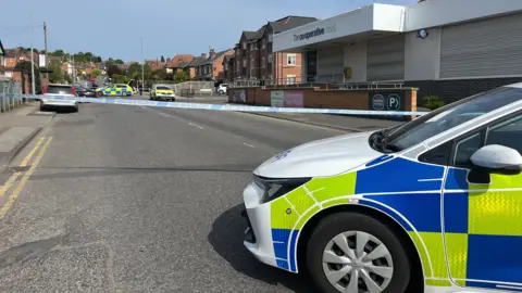 Cordon near supermarket on residential road