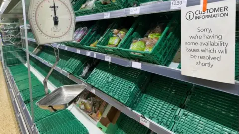 Empty shelves in a Co-op store