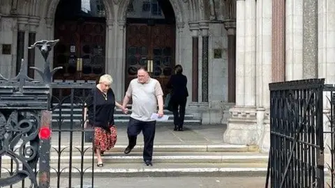 Ann Ming and Kevin Hogg outside the Royal Courts of Justice