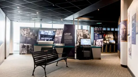 Displays and photographs on boards and on walls as part of an exhibition called Through Our Eyes, currently on show at Holocaust Centre North