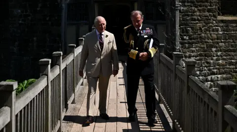 Reuters King Charles III on drawbridge outside Walmer Castle with Admiral of the Cinque Ports Admiral Sir George Zambellas