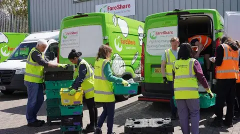 FareShare Sussex & Surrey Volunteers for FareShare Sussex & Surrey carrying crates of food into vans.