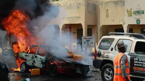 A car on fire after bombing in Nigeria's north eastern Gombe state in 2015