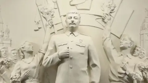 Statue of Joseph Stalin carved in white stone
