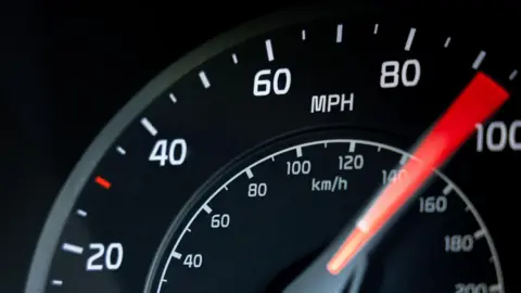 A close up stock image of a cars speedometer 