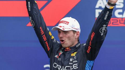 Max Verstappen holds aloft the trophy after winning the Canadian Grand Prix