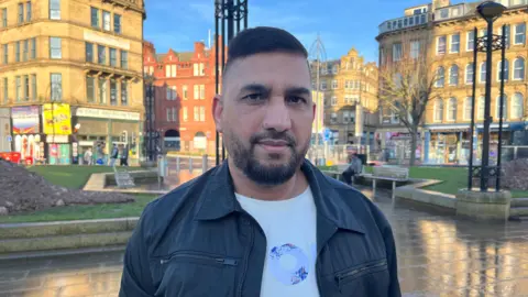 Syed Bukhari standing in Bradford city centre