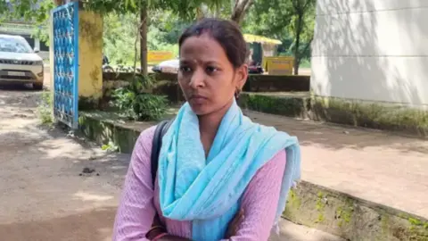 BBC Hindi Jyoti Yadav standing alone in front of a pavement