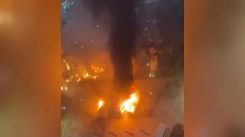 Layla Hamood Flames engulf the car park and the area around the couple's hotel in Dubai