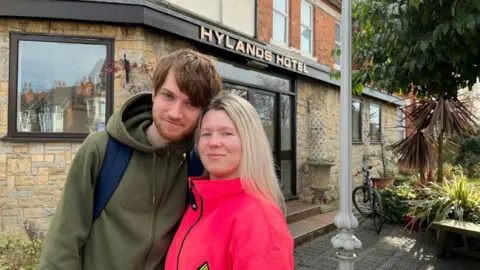 Victoria Smith stood outside the Hylands Hotel with her partner.