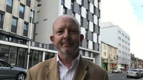 Jonathan Adams outside student flats on City Road