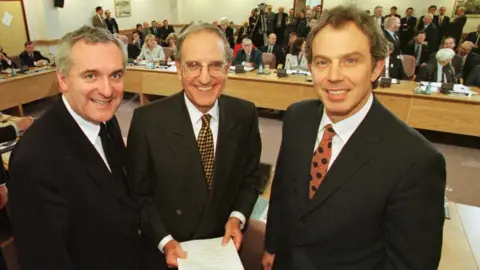 PA Media Bertie Ahern, George Mitchell and Tony Blair