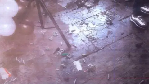 West Midlands Police Capsules and balloons on floor of venue