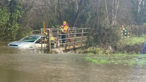 Shropshire Fire and Rescue Service The car in flood-water