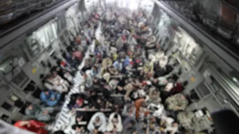 MOD A blurred-out image of people aboard a military plane