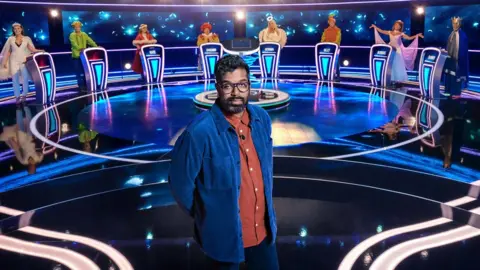 BBC Romesh Ranganathan with contestants on the set of Weakest Link