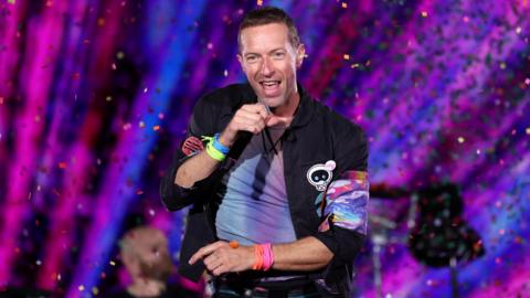 Chris Martin performs at Rose Bowl Stadium in Pasadena with colourful confetti