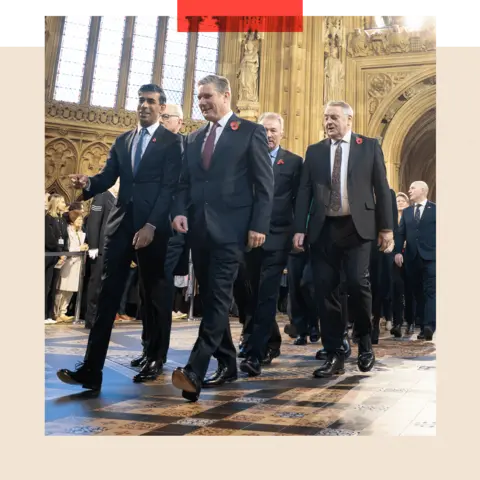 Getty Images Then-Prime Minister Rishi Sunak and Labour leader Sir Keir Starmer lead MPs through the Central Lobby at the Palace of Westminster ahead of the State Opening of Parliament in November 2023