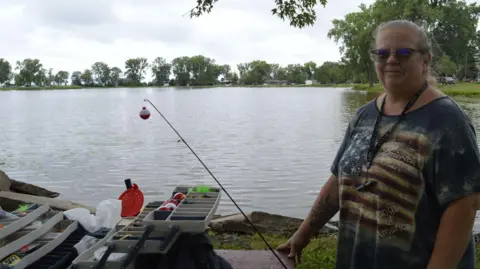 Holly Lapnow fishing on the lake