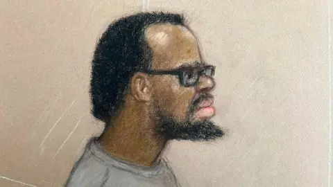 Julia Quenzler A sketch of a man with a black beard and black afro hair and black rimmed spectacles wearing a grey top.