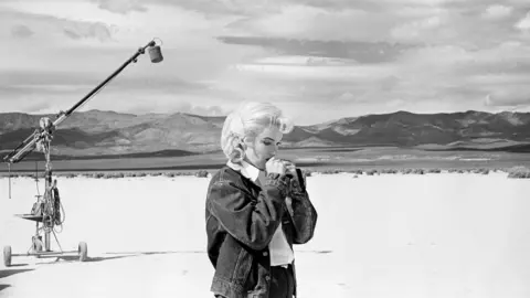 Eve Arnold/Magnum Photos Marilyn Monroe preparing for a scene from "The Misfits" in the Nevada desert, 1960