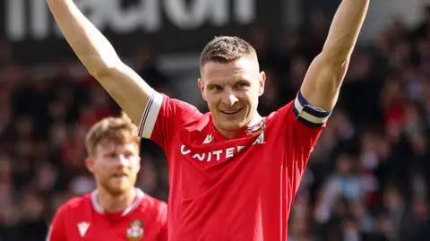 Paul Mullin celebrates scoring for Wrexham